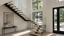 Modern floating glass staircase with white oak treads, black steel mono stringer, and clear glass railing in a bright contemporary home.