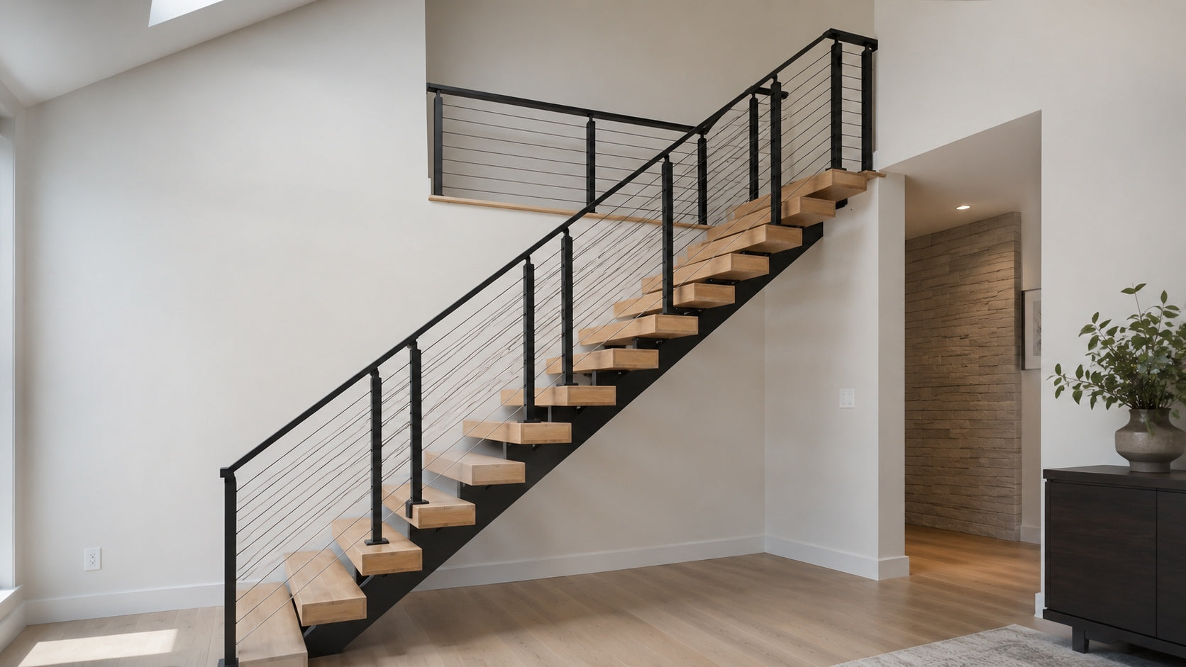 Thick white oak hardwood stair treads on a modern floating stair system with matte black steel support