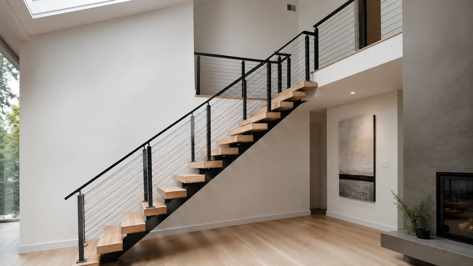 Steel floating stairs with white oak treads, a matte black mono stringer, and clear glass railing in a modern North American home.